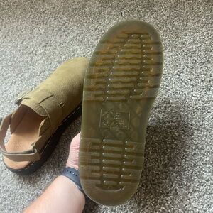 Olive colored Dr. Marten mules.